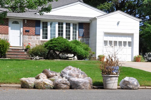 Home clearance team organizing items in a Regents Park residence