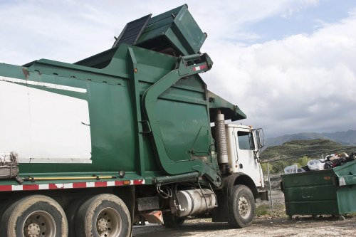 Waste collection trucks in North West London streets